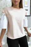 Pink top with puff sleeve with lace up and bare.