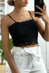 Women's lace tank top lined with removable strap.