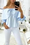 Very chic women's blouse in blue with butterflies decorated with rhinestones on the front