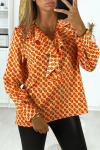 Women's blouse with an orange pattern with a ruffle at the front.