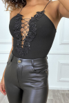 Black low-cut bodysuit with thin straps and lace flowers