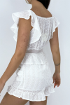 White playsuit with ruffles and openwork boho style details.