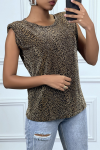 Golden t-shirt with shoulder pads and leopard pattern.
