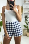 Women's high waisted blue checkered shorts with side closure.