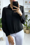 Women's black shirt with rhinestones on the collar.