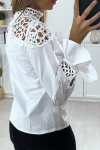 White women's blouse with satin and beaded pattern bust.