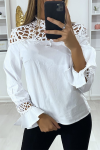 White women's blouse with satin and beaded pattern bust.