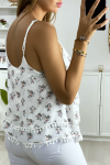 Women's tank top in white with a ruffle with a bird motif and a mini pompom.