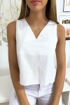White backless top with women's bow to wear for all occasions.