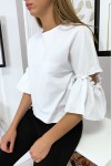 Women's summer blouse with flying sleeves and bow.