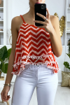 Tank top with red and white pattern in the shape of a zigzag with flounce and mini pompom