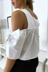 White crop top blouse with bows.
