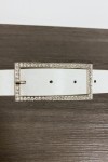 White faux leather belt with rectangular buckle adorned with rhinestones.