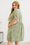 Plus size green dress with white pattern
