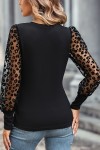 Black top with leopard print sleeves