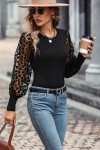 Black top with leopard print sleeves