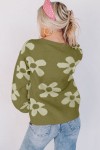 green sweater with large flowers