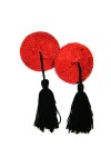 Adhesive red nipple covers with black pompoms