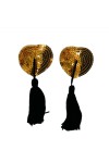 Heart-shaped nipple covers with gold sequins and black pompoms