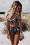 Black bandeau swimsuit with white polka dots