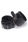 Pair of black faux leather handcuffs with faux fur