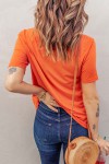 Orange t-shirt with a hole