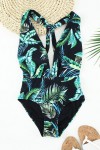 Black 1-piece swimsuit with tropical pattern
