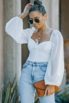 White bodysuit with puff sleeves